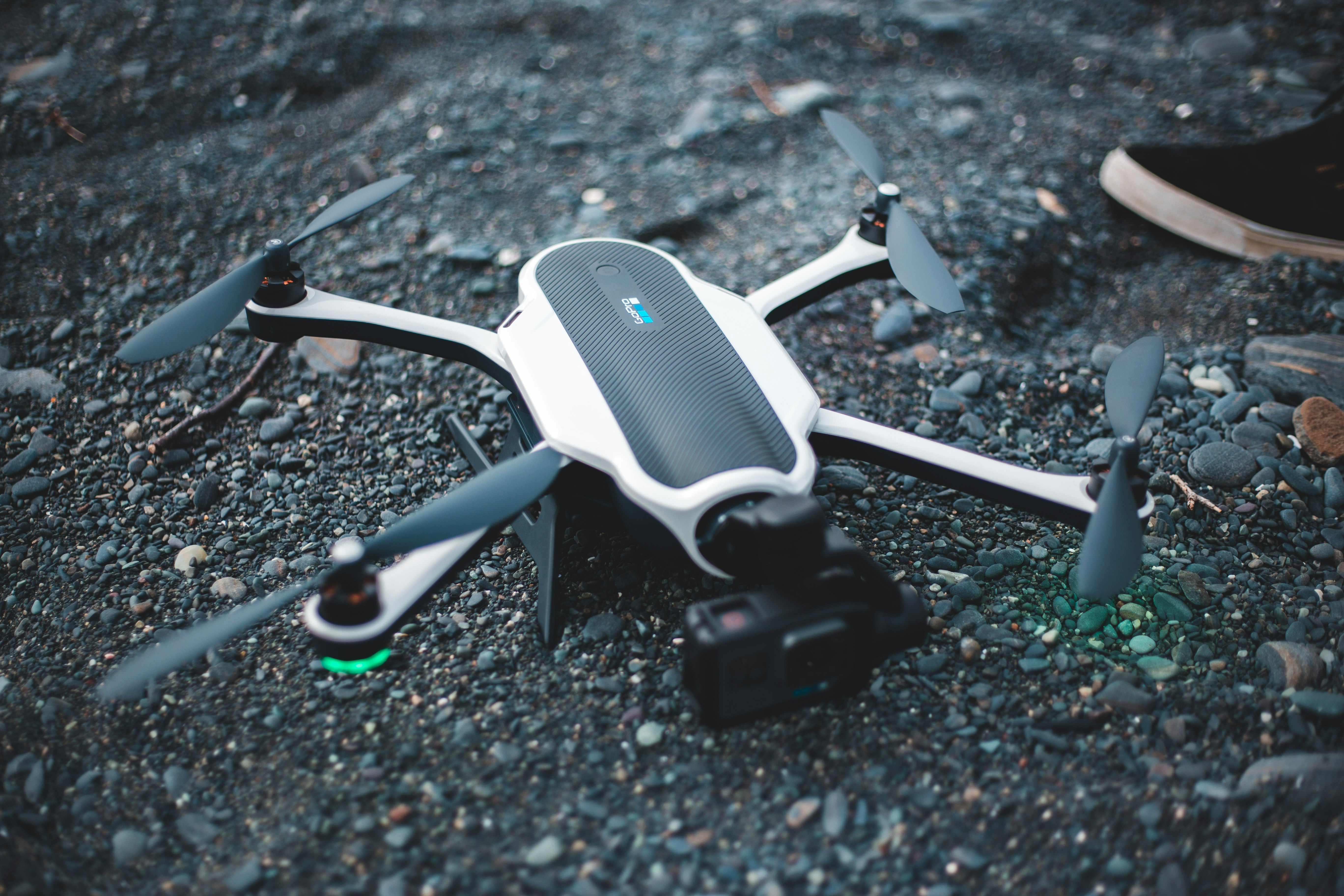 white and black drone on black and white marble table